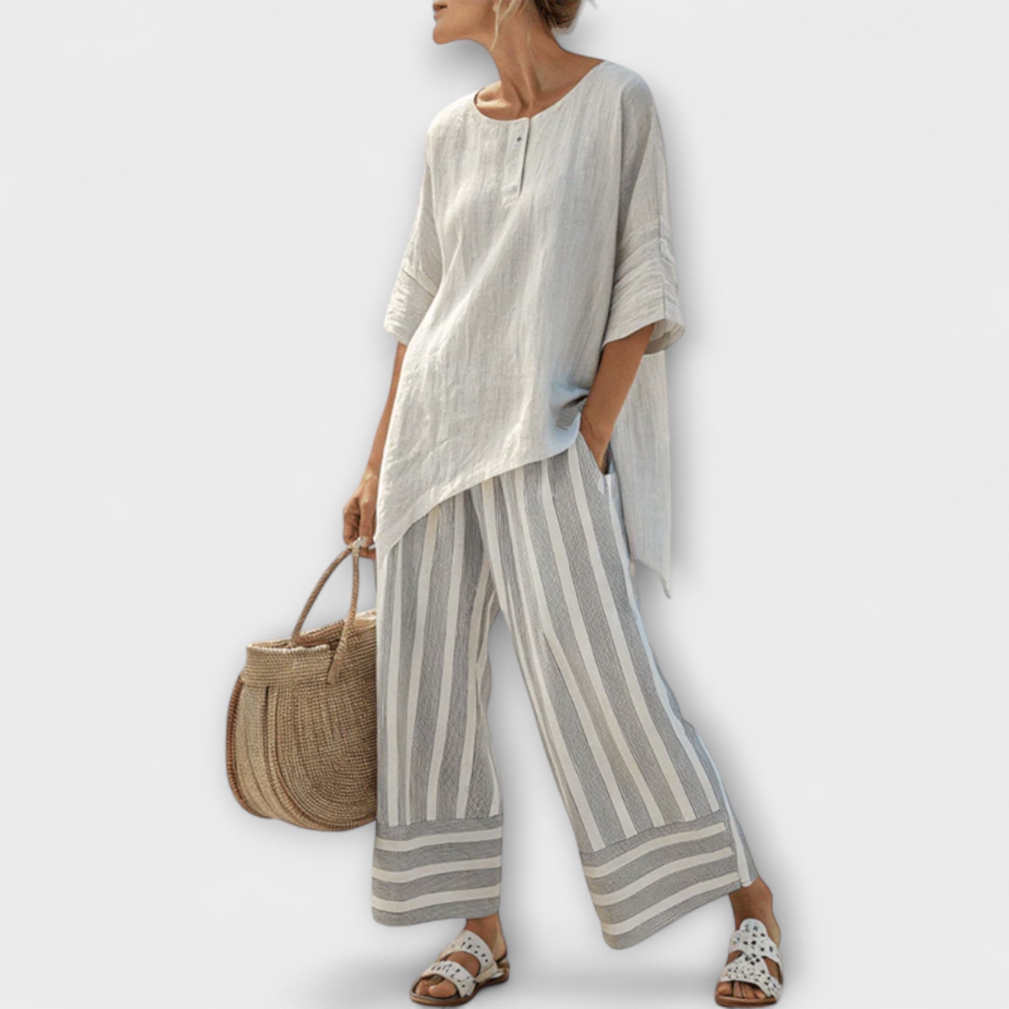 Lucy - Blusa Asimmetrica e Pantaloni a Righe Verticali